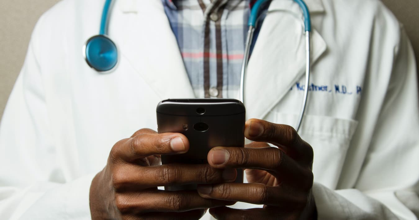 Doctor holding a cell phone