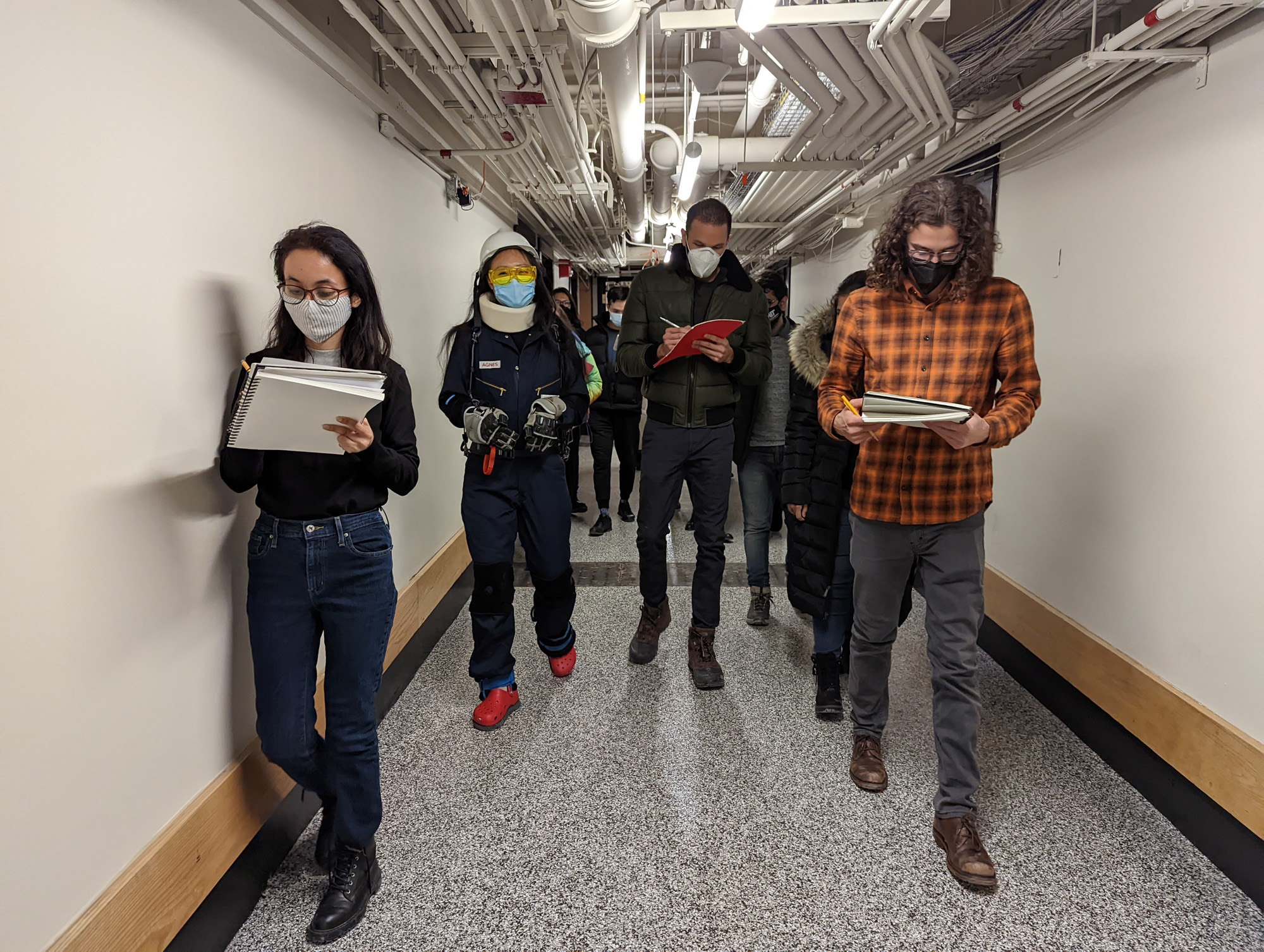 AGNES and students walking down hallway